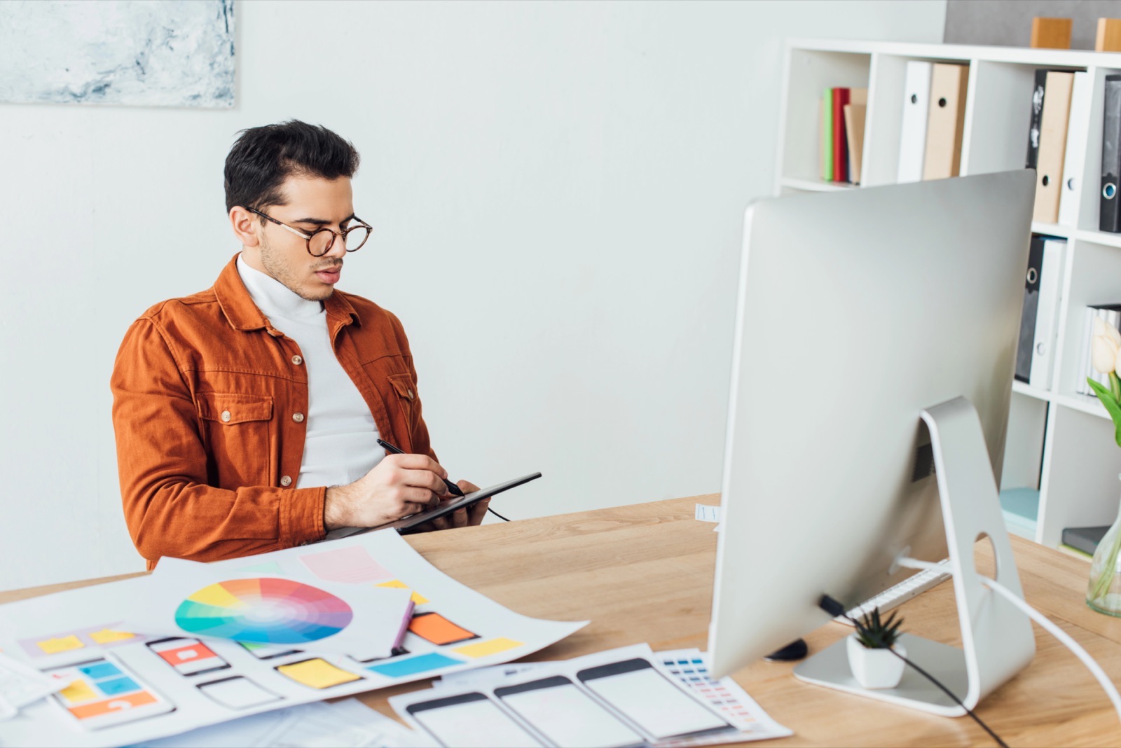 Web designer planning website layouts and colours